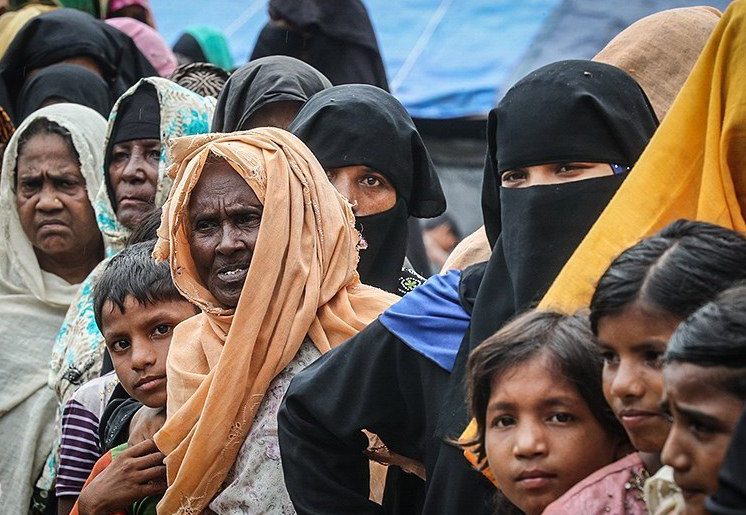 People wearing head scarves in crowd